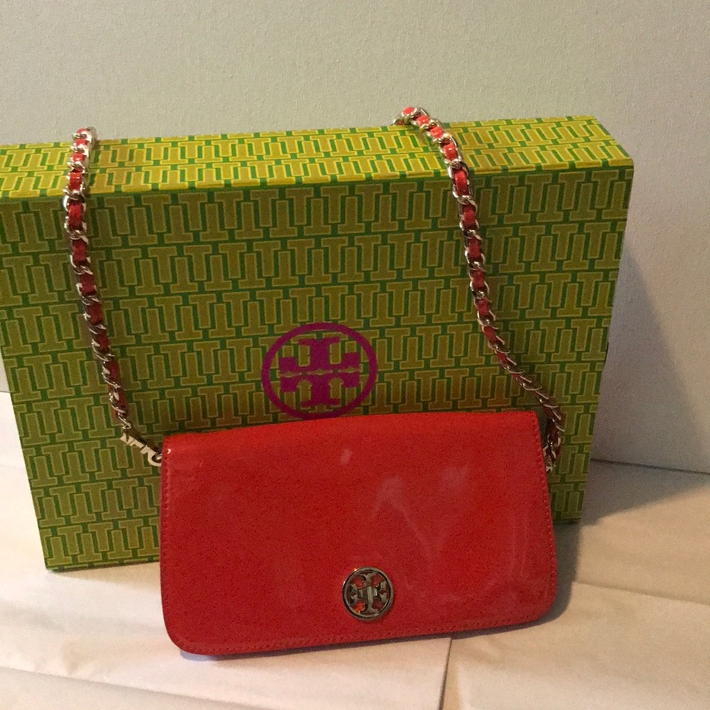 Tory Burch Orange crossbody patent leather bag.